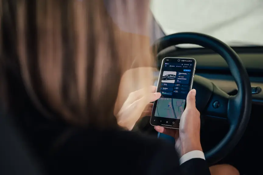 Woman in a car uses Fleets app